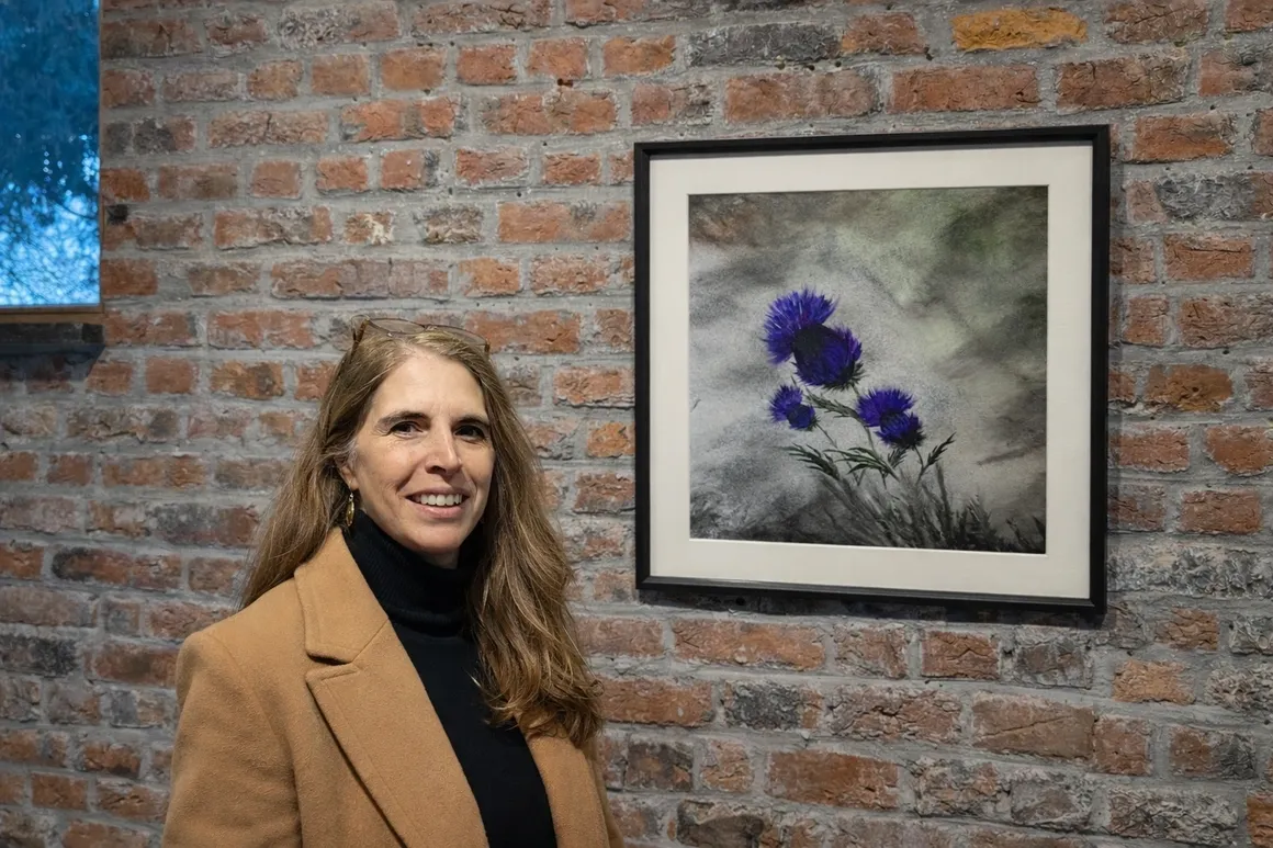 Dizzywalker at an exhibition with Blooming Dreams artworks
